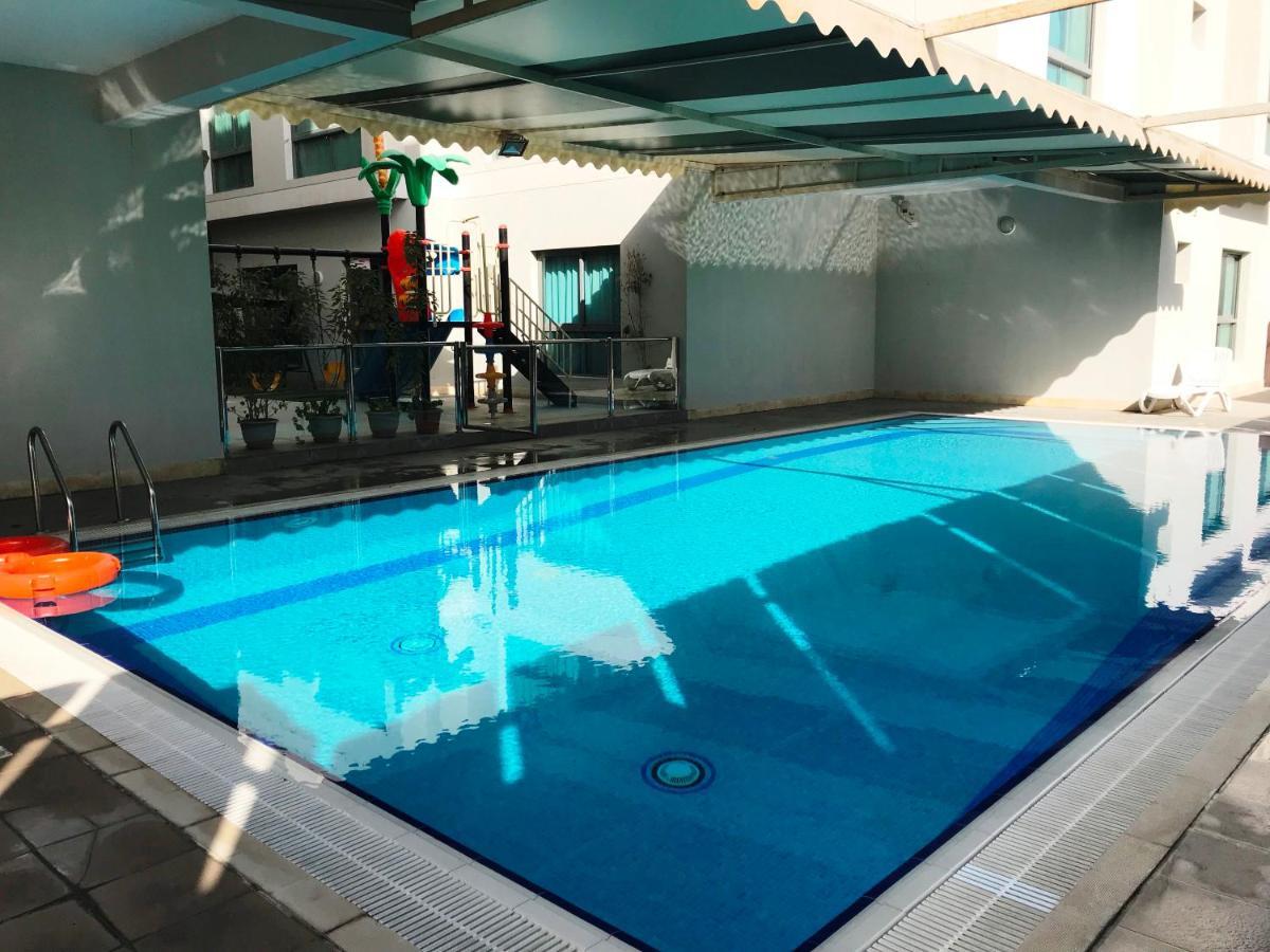 Stout Apartments Manama Room photo